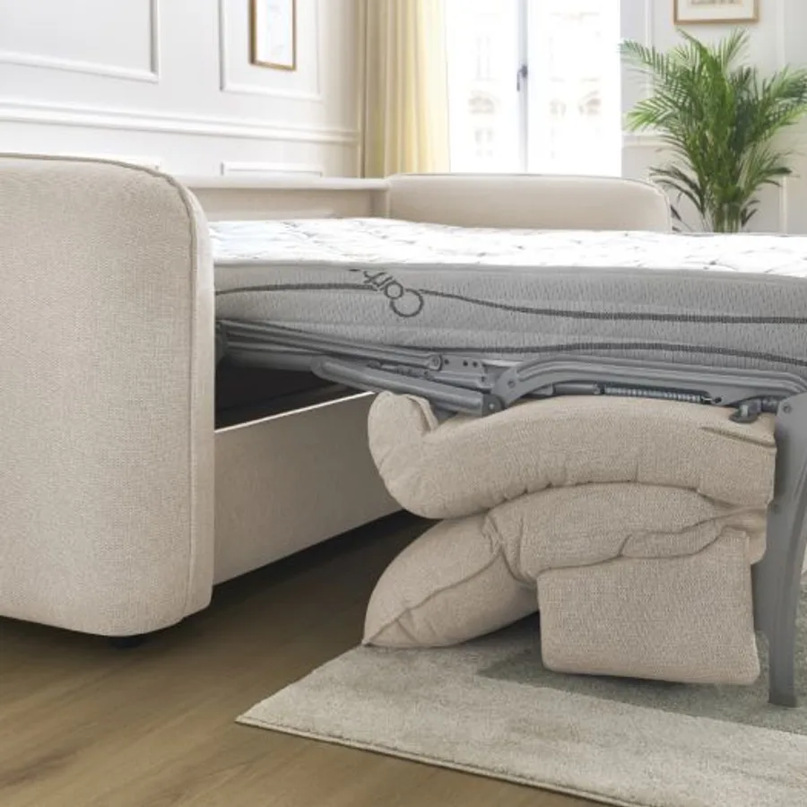 Canapé Achille convertible semi-ouvert montrant le mécanisme de dépliage et le matelas.