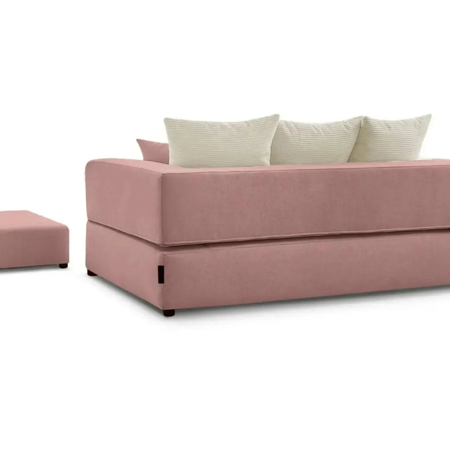 Canapé Ambre rose convertible avec mécanisme ouvert montrant les repose-pieds intégrés