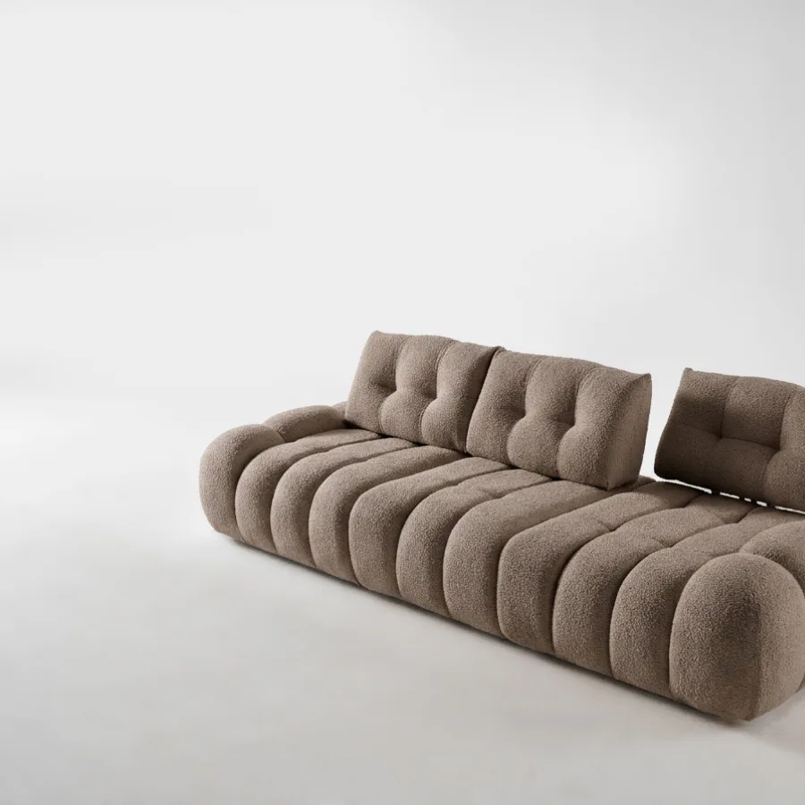 Canapé Apollon en tissu taupe, vue de profil trois quarts, avec dossier amovible.