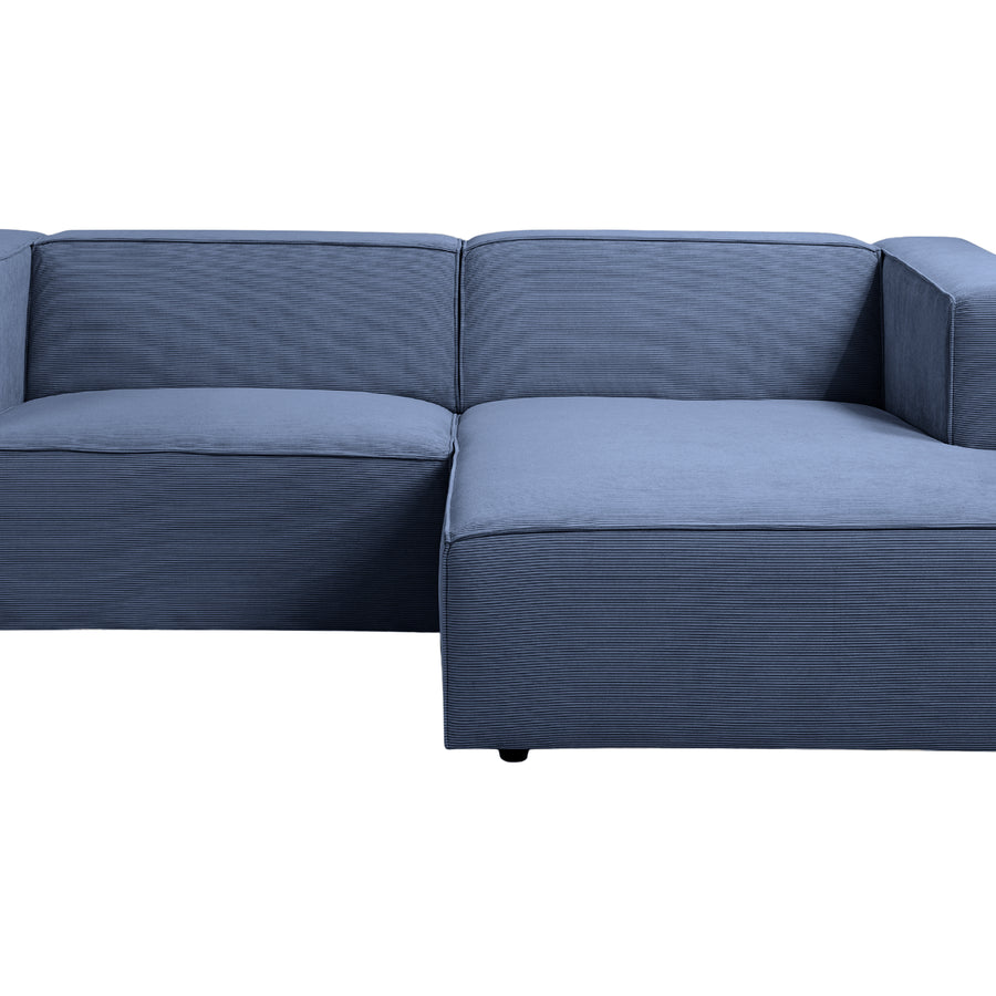 Canapé Basil bleu d'angle vu de profil montrant l'architecture modulaire du canapé