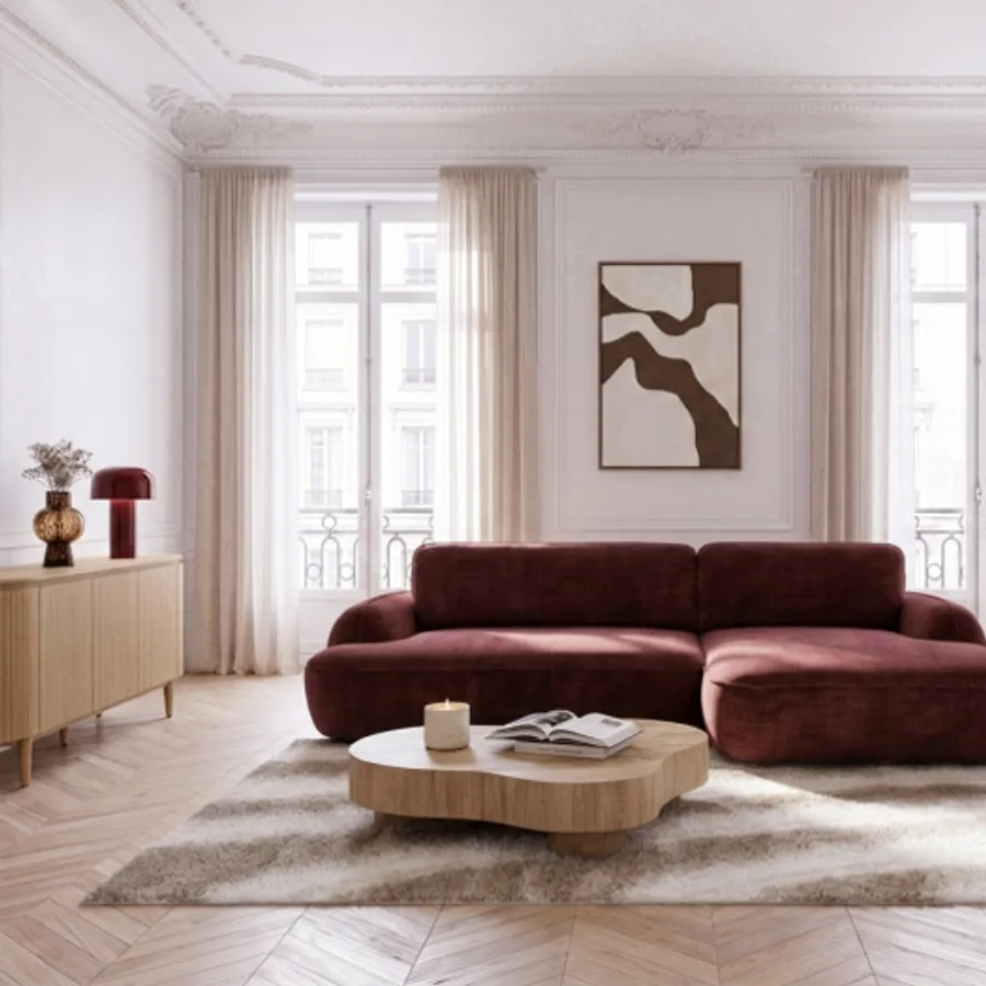 Canapé Céleste angle bordeau dans grand salon blanc avec fenêtres et table basse