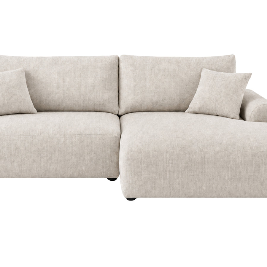 Canapé Elias angle beige en tissu, vue frontale avec la méridienne à droite