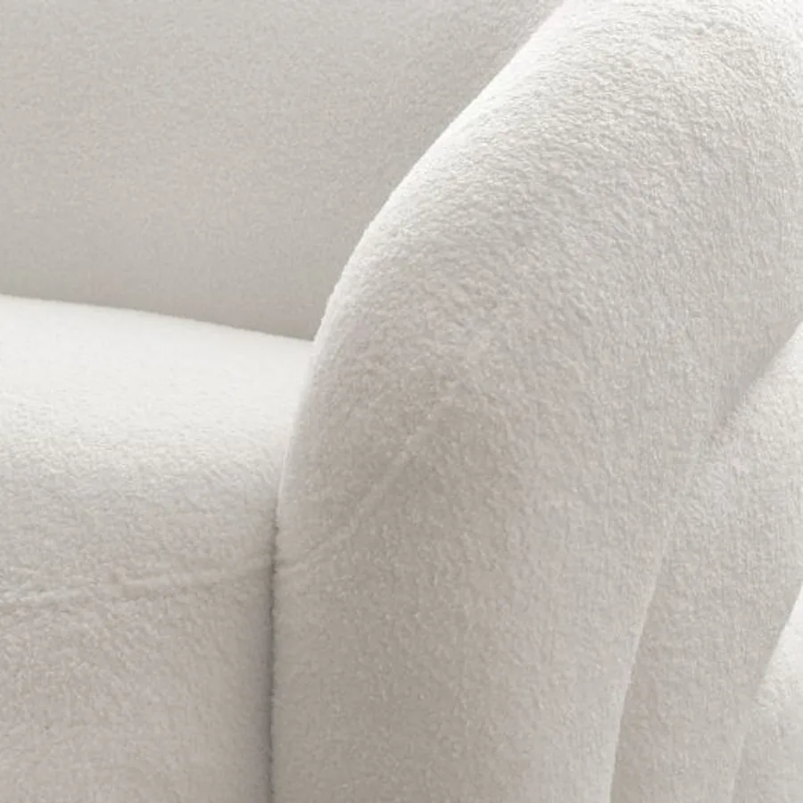 Gros plan sur la texture du tissu blanc du canapé Elina et les coutures.