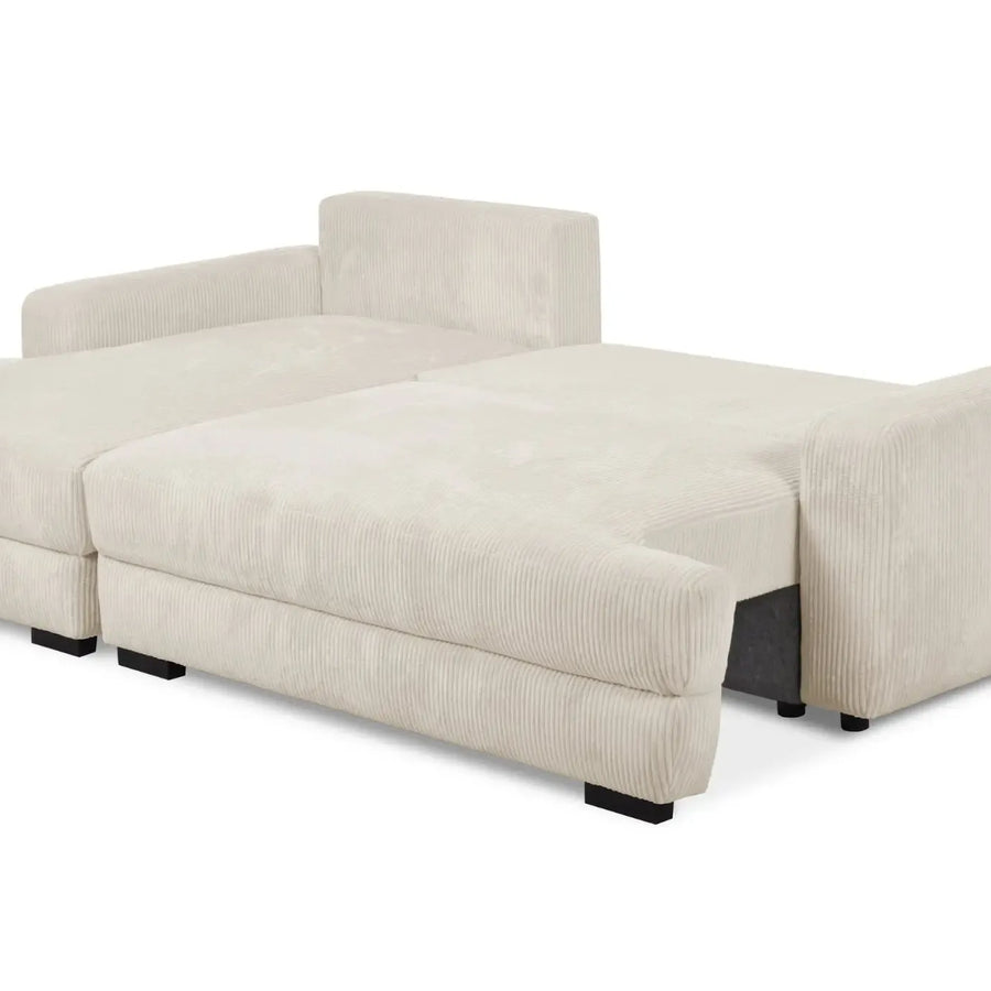 Canapé Faustine convertible ouvert en lit avec matelas visible et accoudoirs relevés.