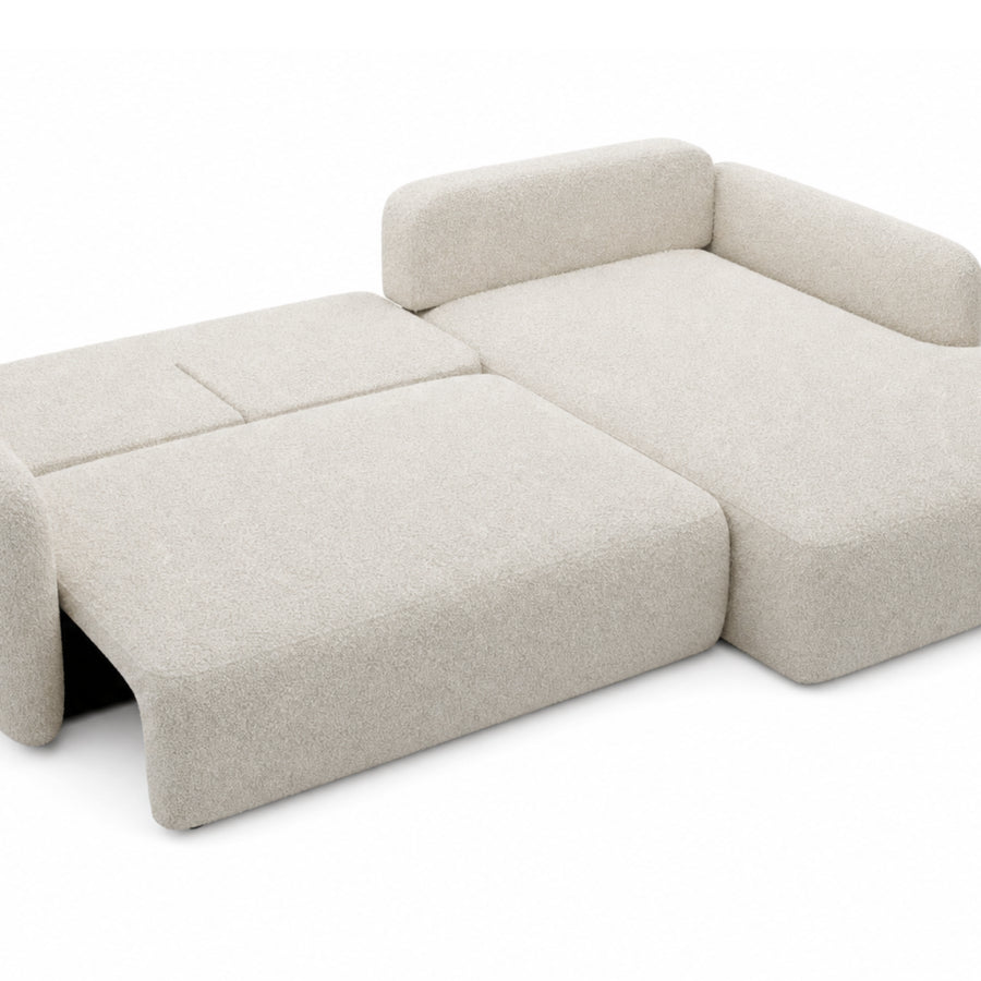 Canapé Gigi convertible beige déplié en lit, matelas visible et méridienne relevée