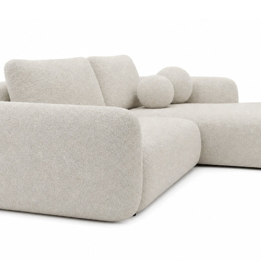 Canapé Gigi angle beige vue de trois quarts, montrant profondeur et structure arrondie