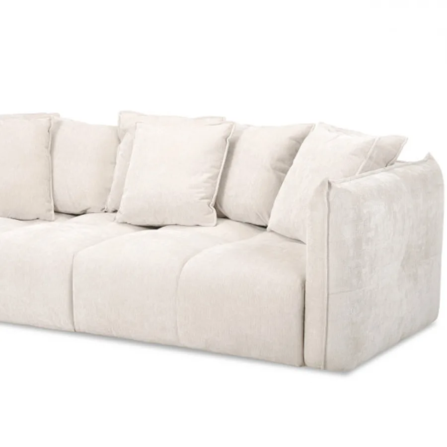 Canapé Harlem beige, vue latérale montrant l'épaisseur et les coussins.