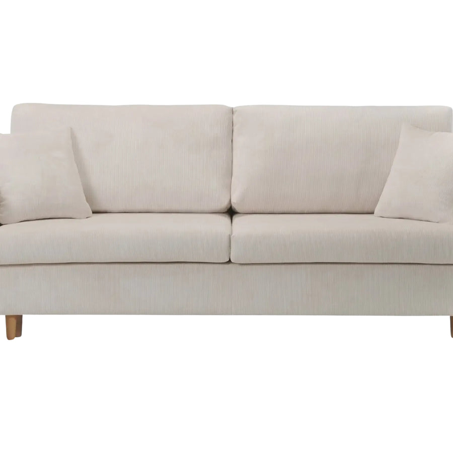 Canapé Lumie beige vu de face, avec quatre coussins et pieds bois apparents.
