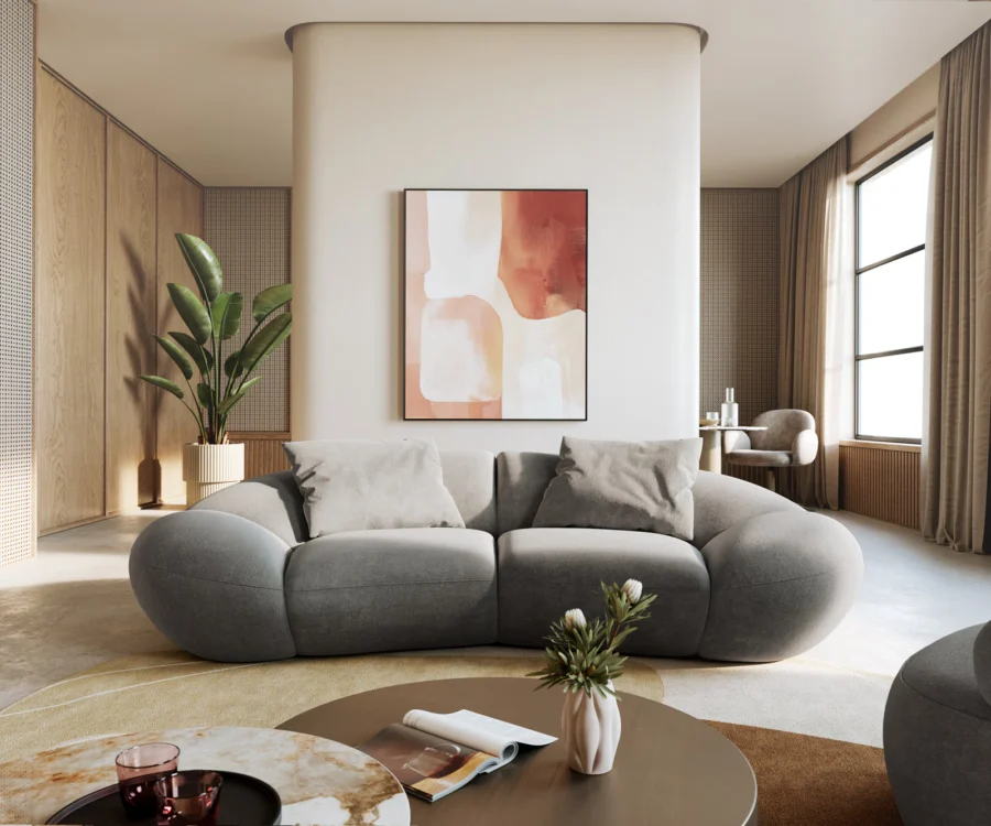 Canapé Lunna gris clair en tissu dans un salon aux murs crème et rideaux beige.