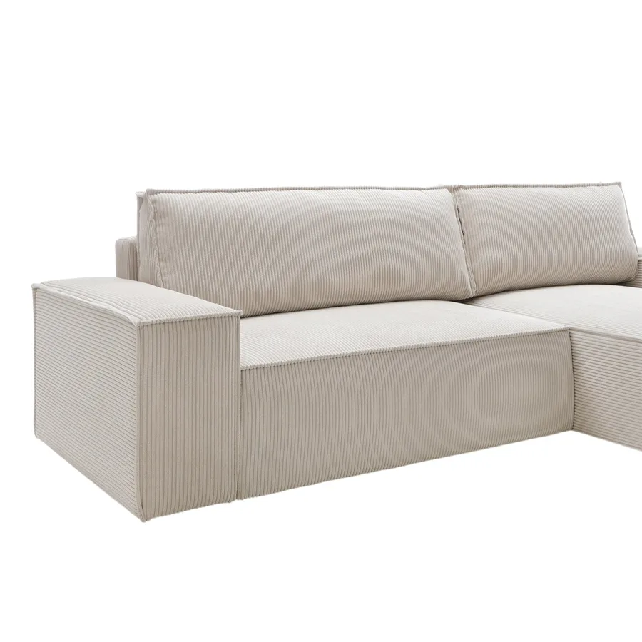 Canapé Napoli angle détouré en tissu beige clair, vue de trois quarts profondeur visible.