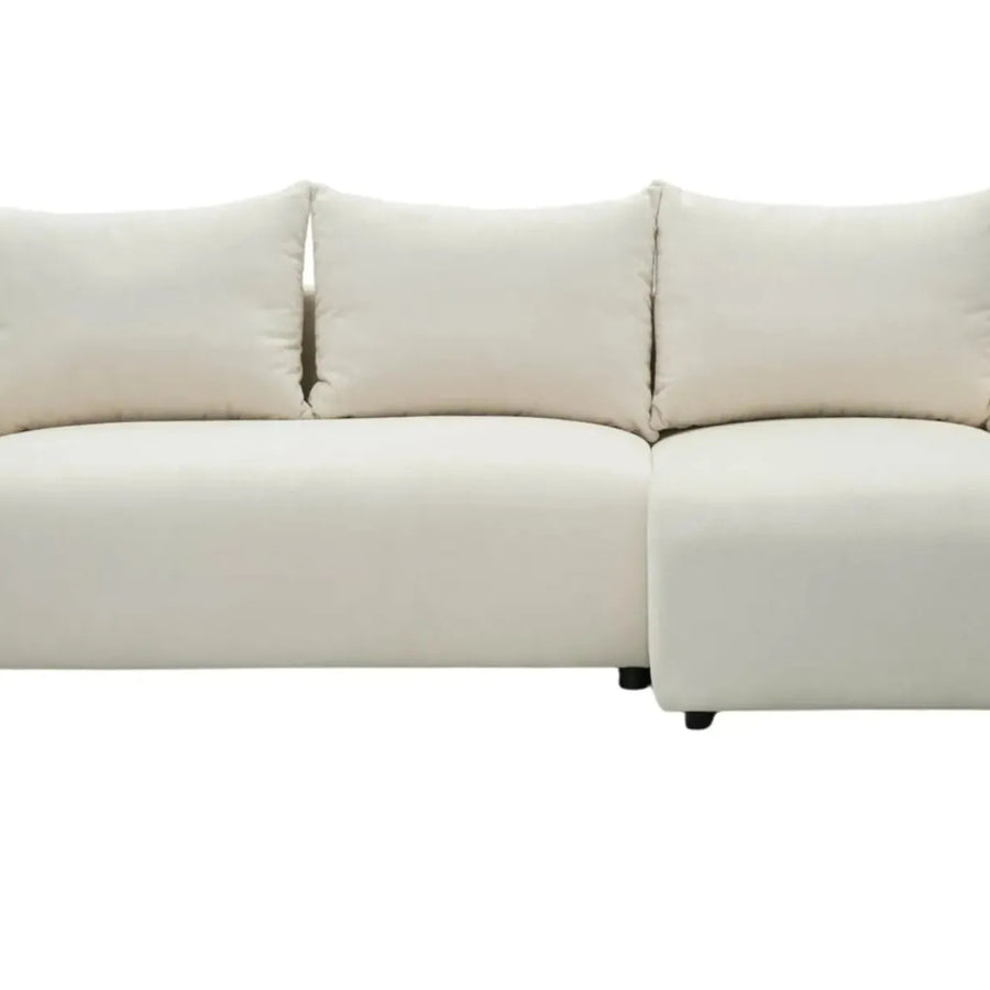 Canapé Océane convertible en tissu beige vu de face avec trois coussins.