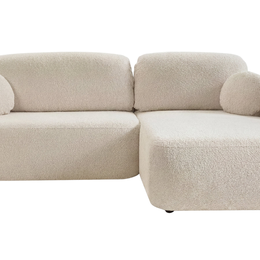 Canapé Santiago angle en tissu beige, vue de profil latéral montrant la structure et les formes